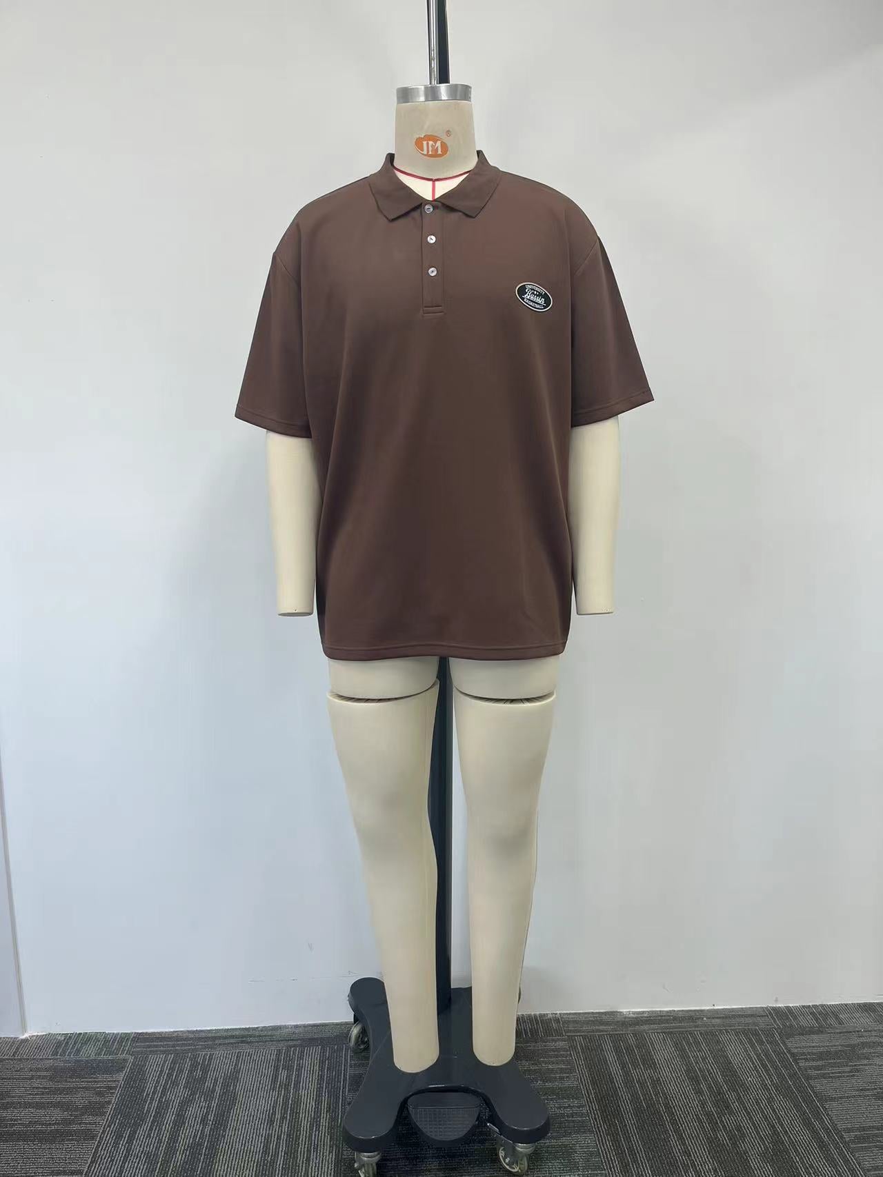 brown polo shirt features a metallic letter print on the back