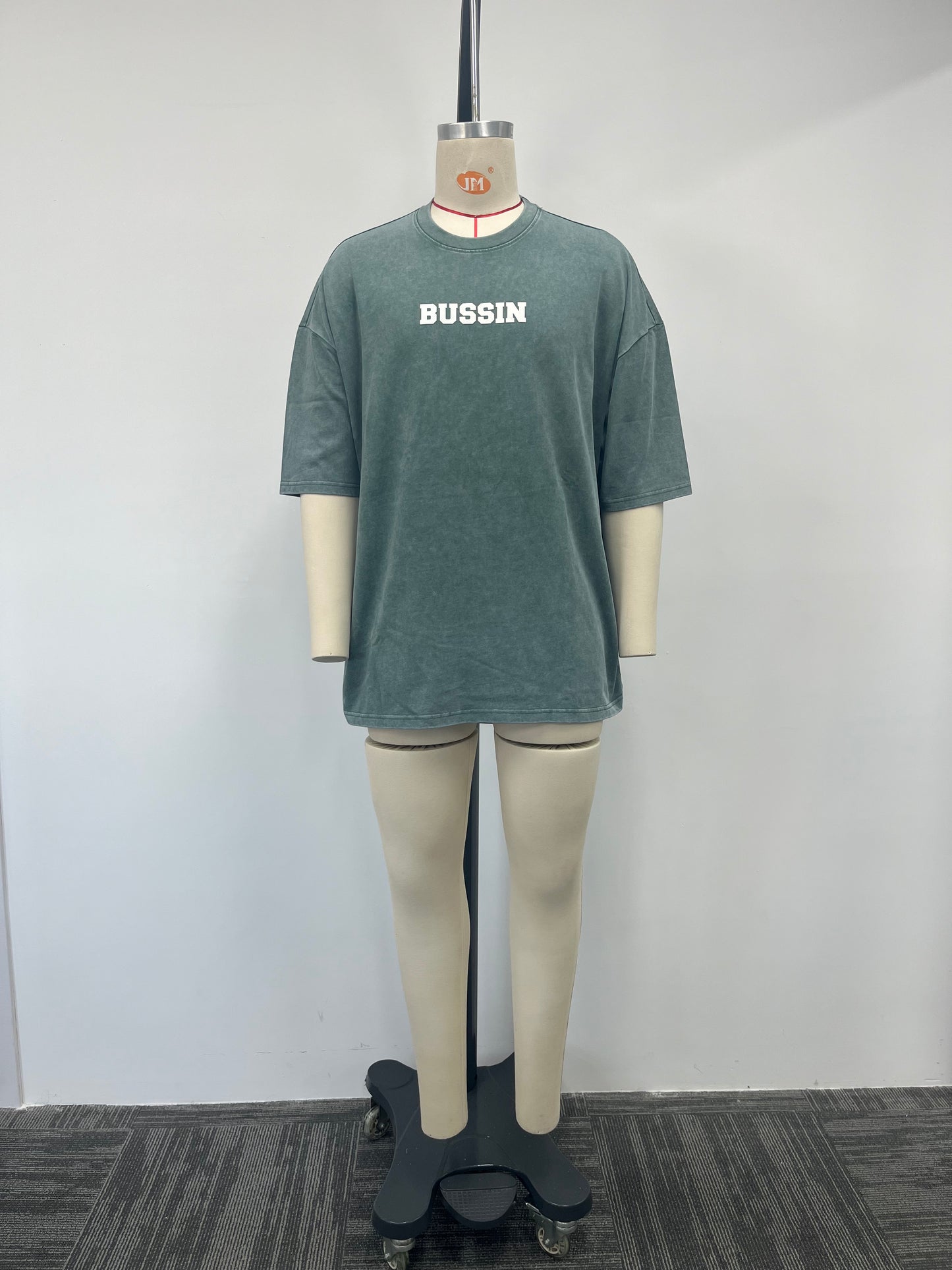Gray-green T-shirt boasts a variety of printing techniques