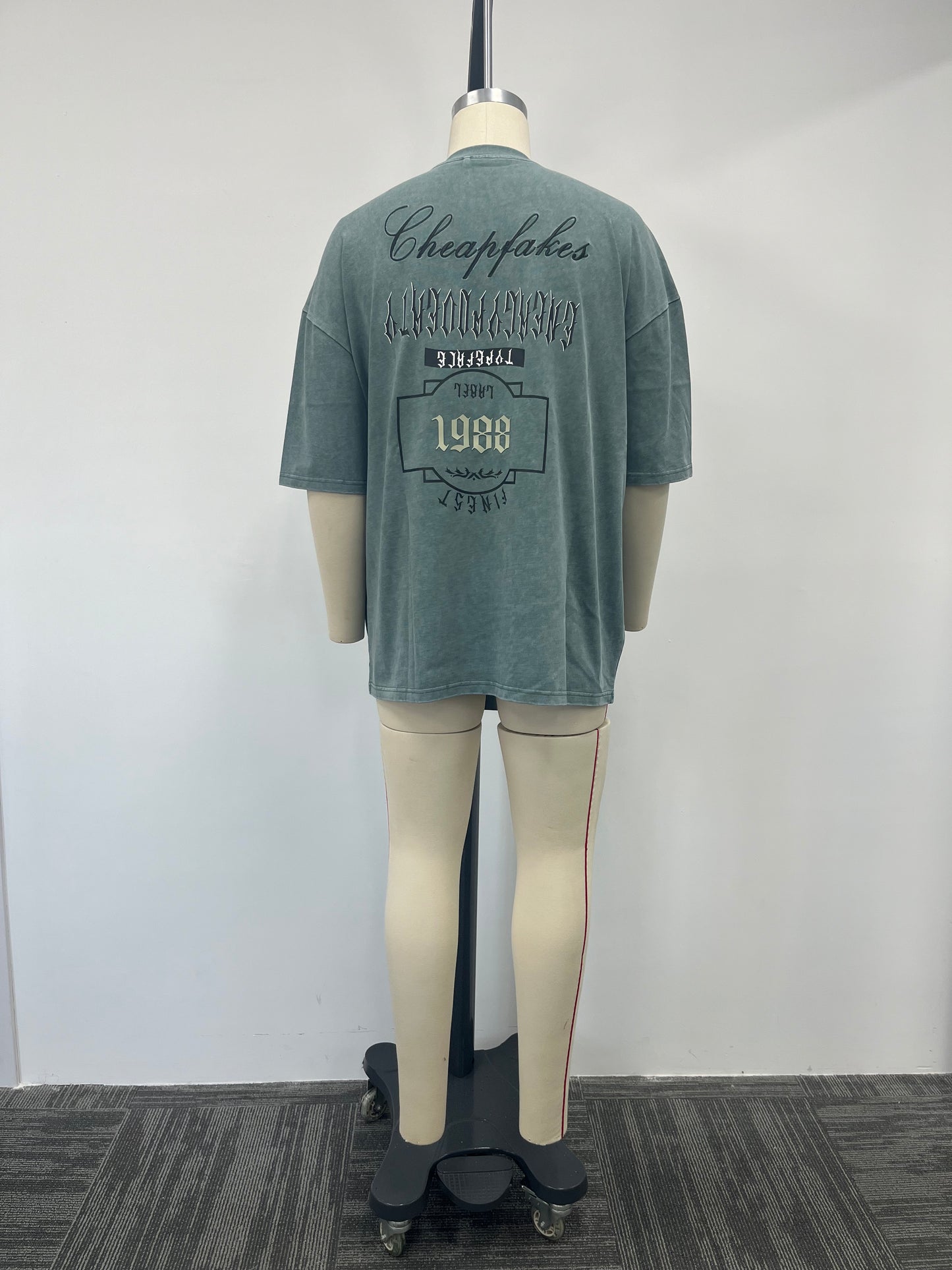 Gray-green T-shirt boasts a variety of printing techniques