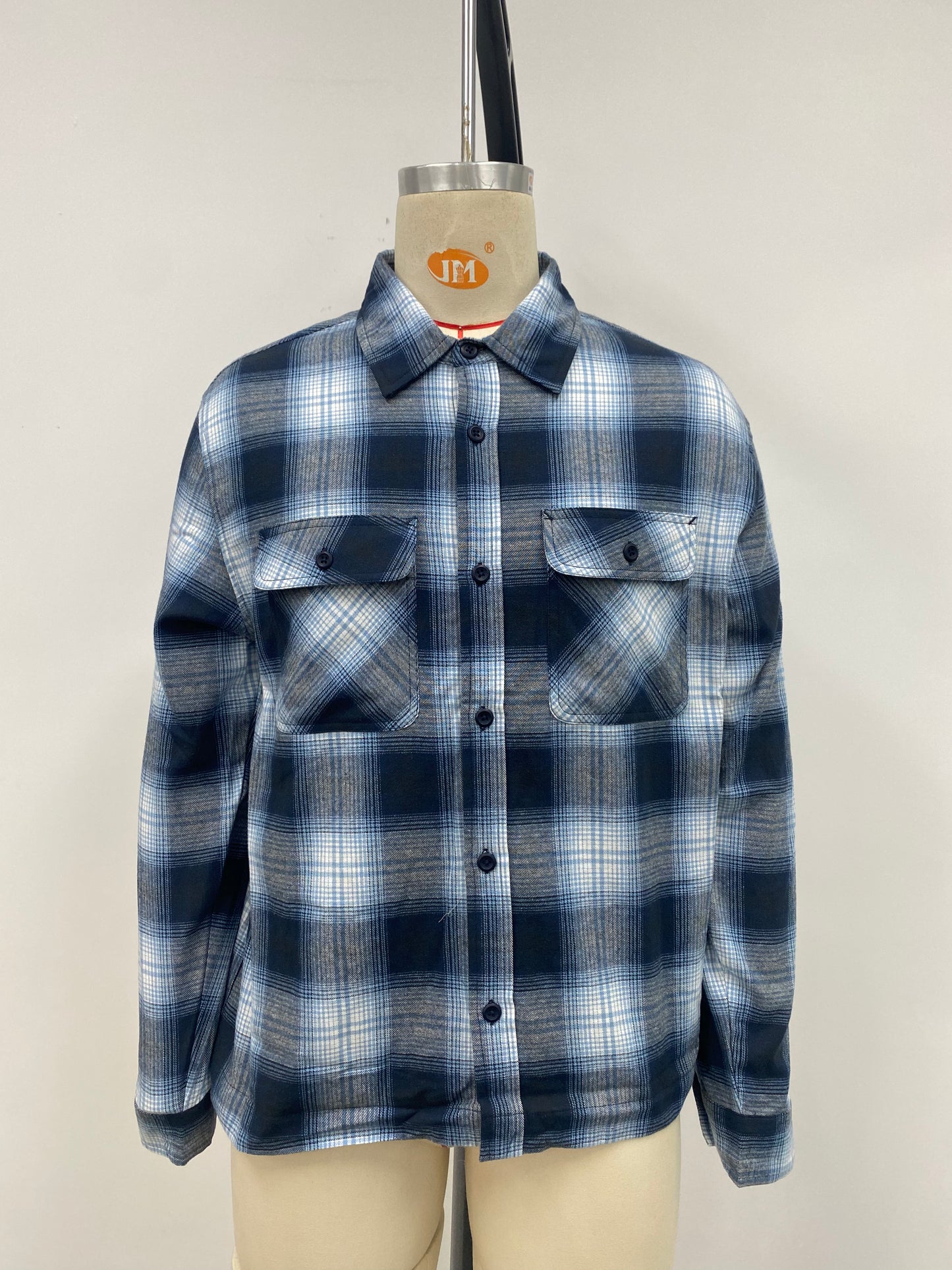 Men's grid-patterned shirt in black and white with blue accents