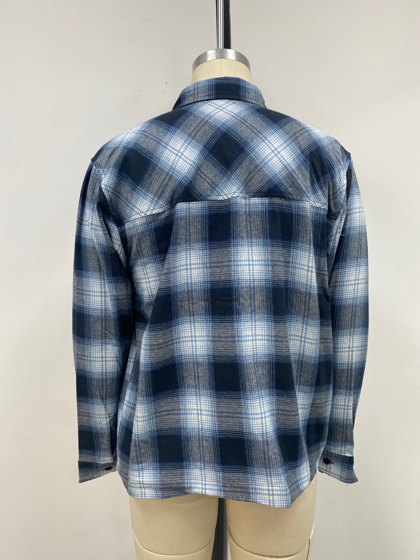Men's grid-patterned shirt in black and white with blue accents
