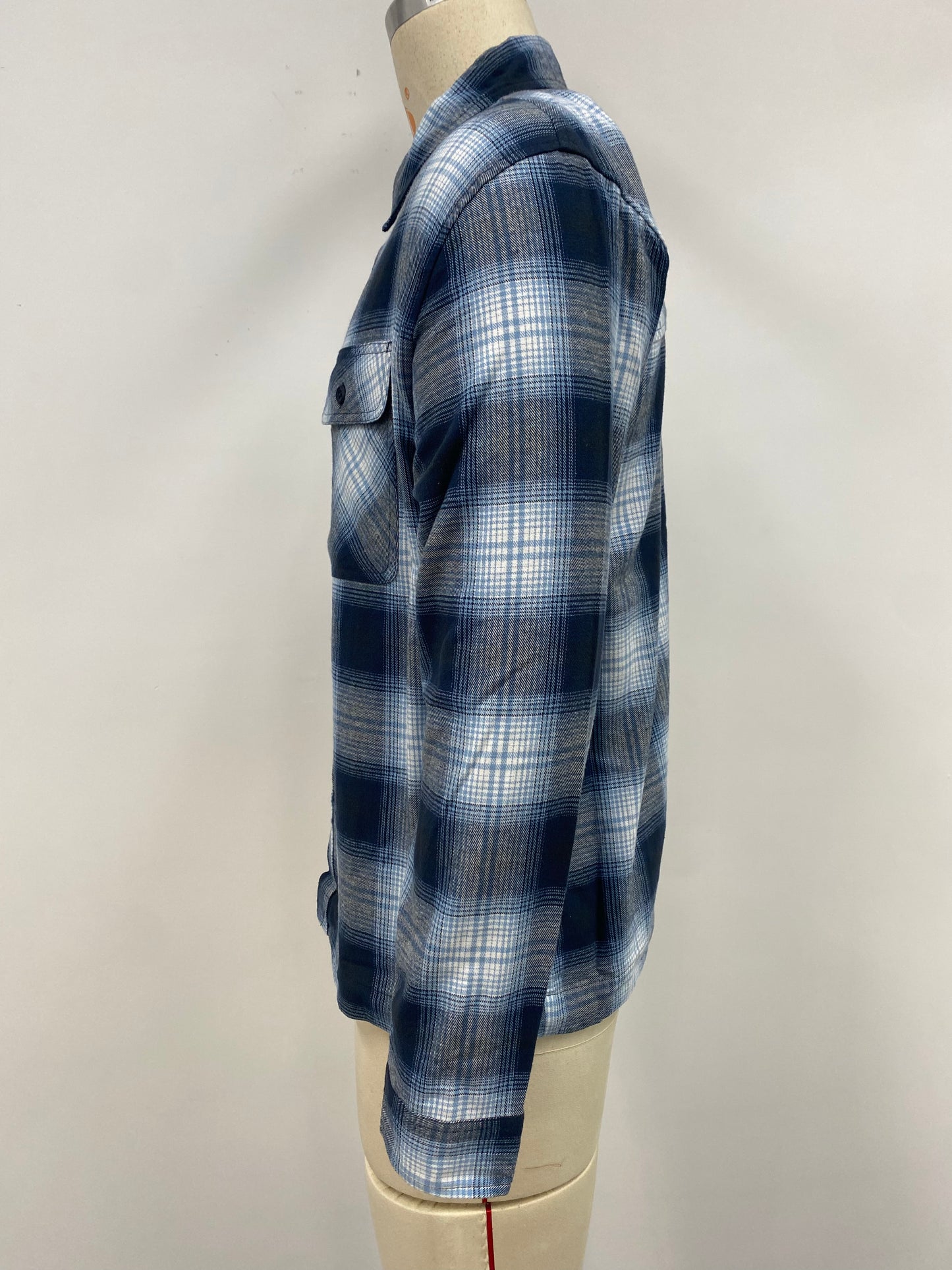 Men's grid-patterned shirt in black and white with blue accents