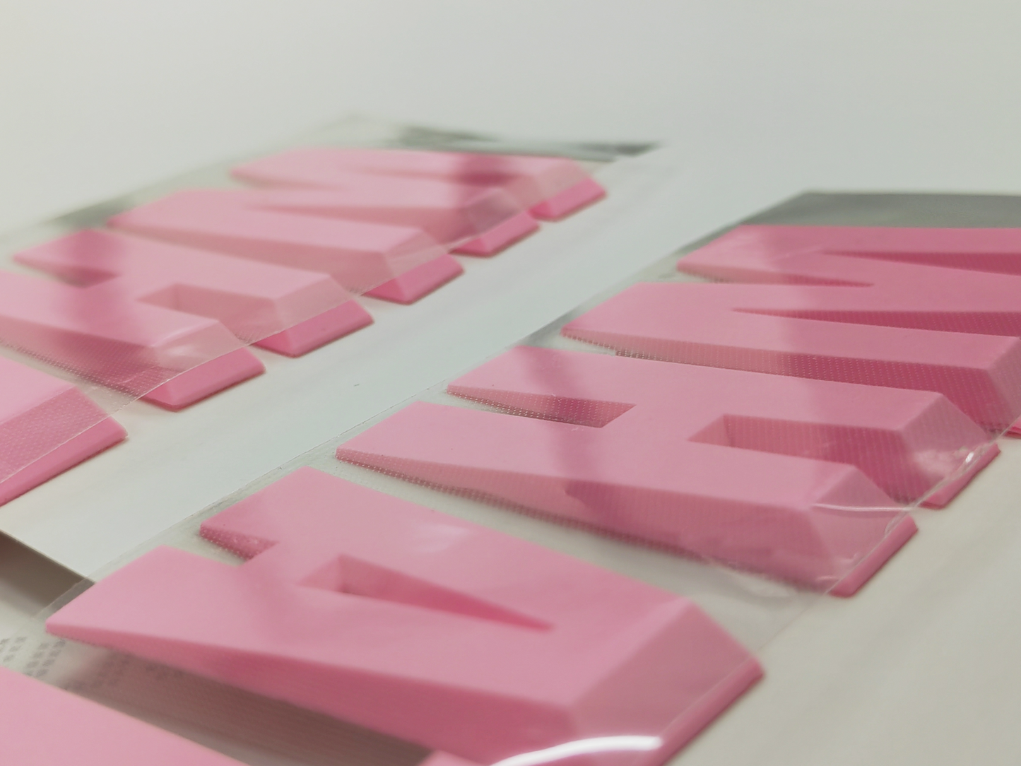 Purple sweatshirt for men features a 3D silicone letter print