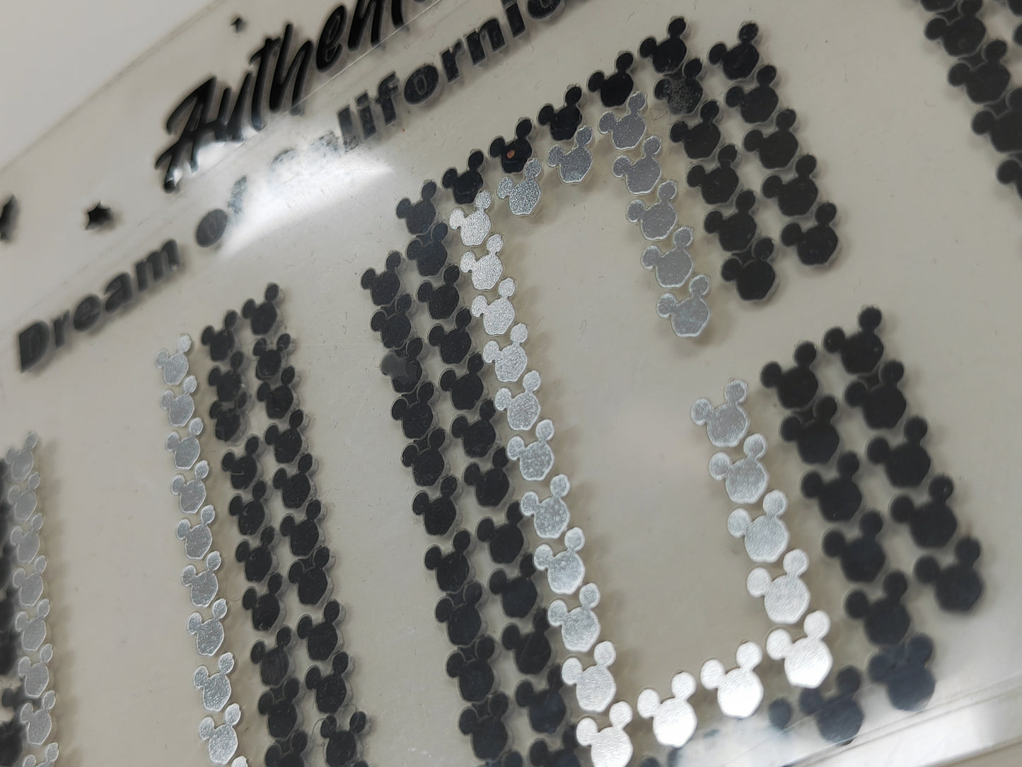 Women's short pink t-shirt features a dual-color floral print