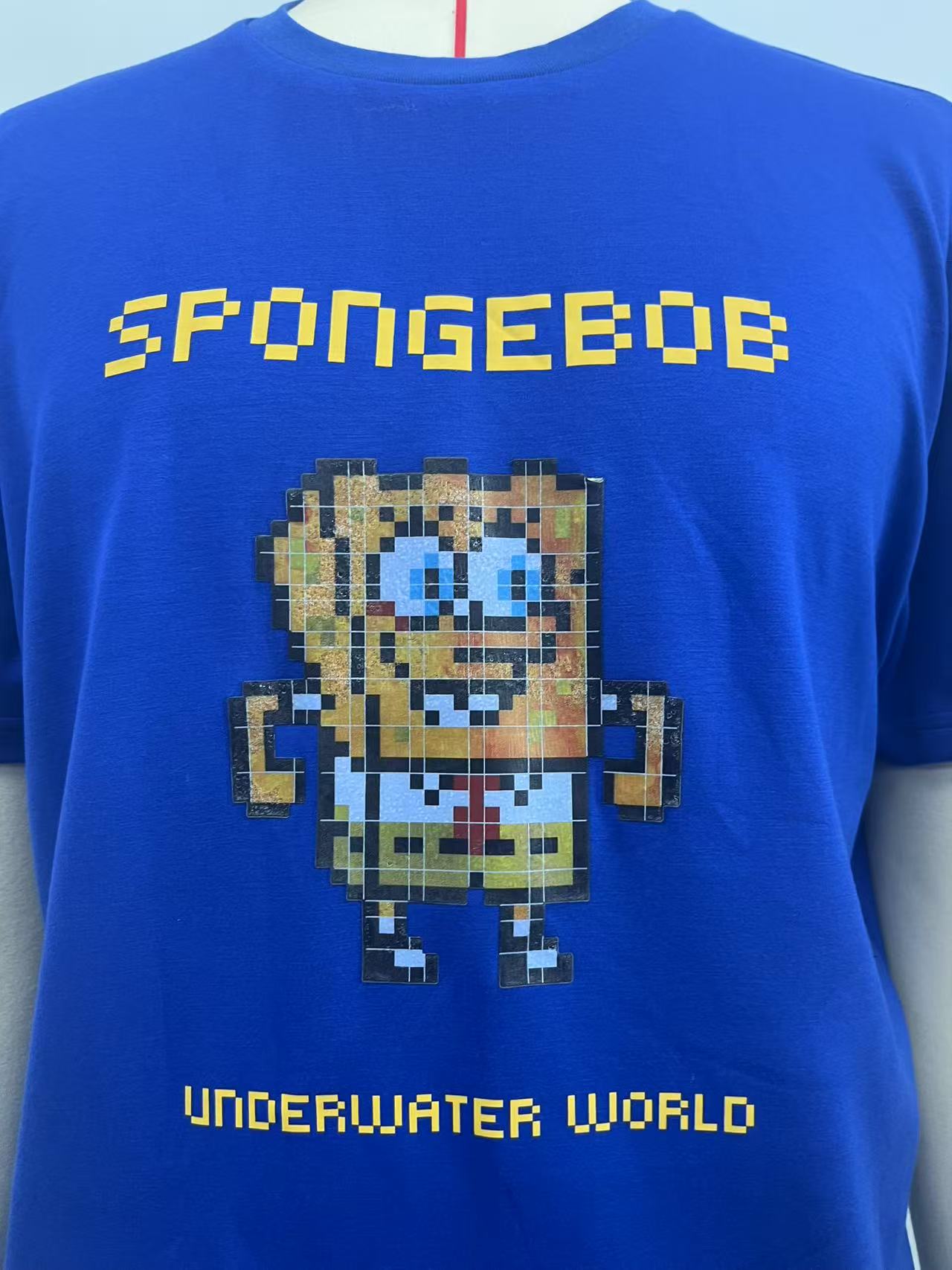 Blue T-shirt with mosaic cartoon pattern print
