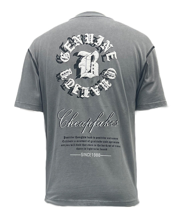 T-shirt features bold letter prints and a playful cream puff design