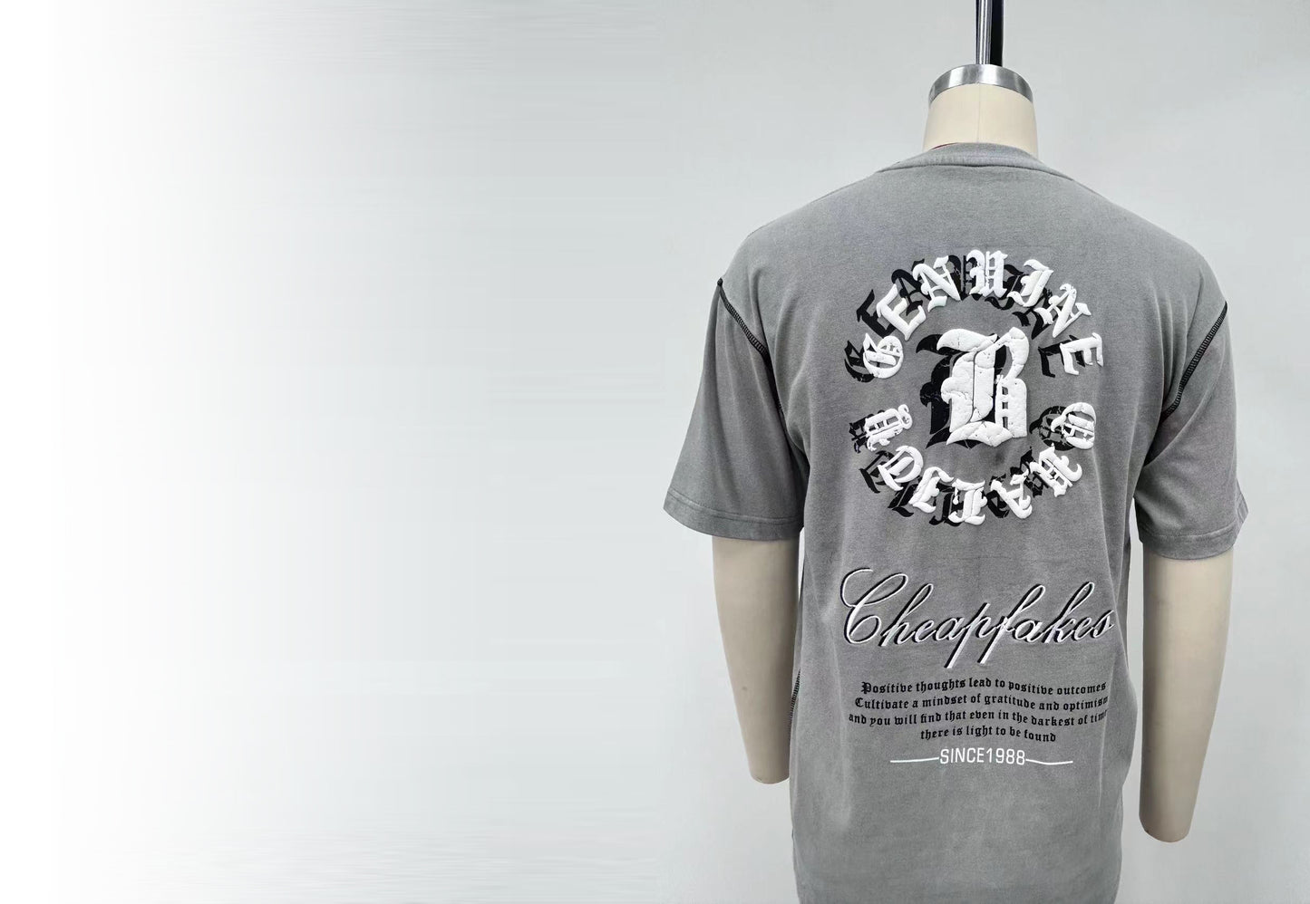 T-shirt features bold letter prints and a playful cream puff design