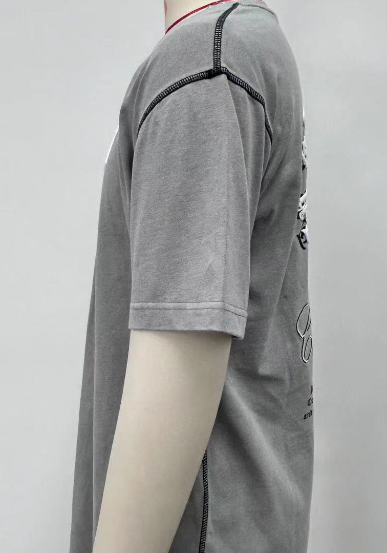 T-shirt features bold letter prints and a playful cream puff design