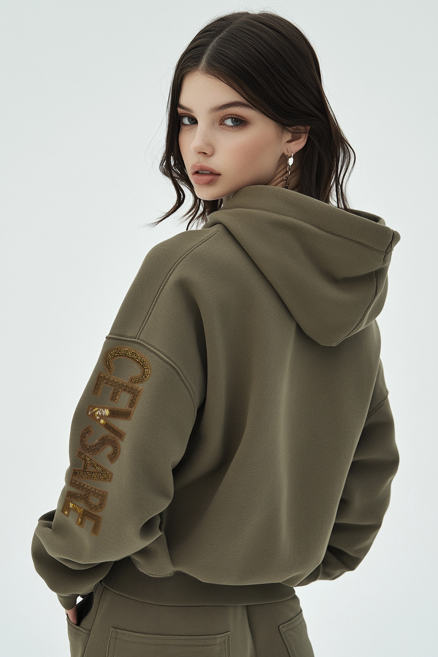 Women's sweatshirt features embellished embroidery on the sleeves