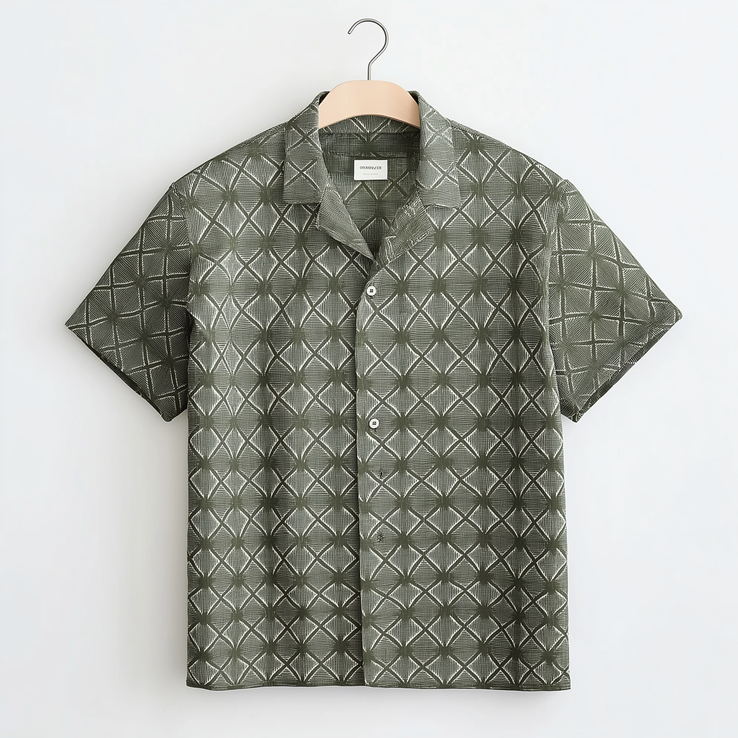 Green short-sleeved shirt features a raised patterned design