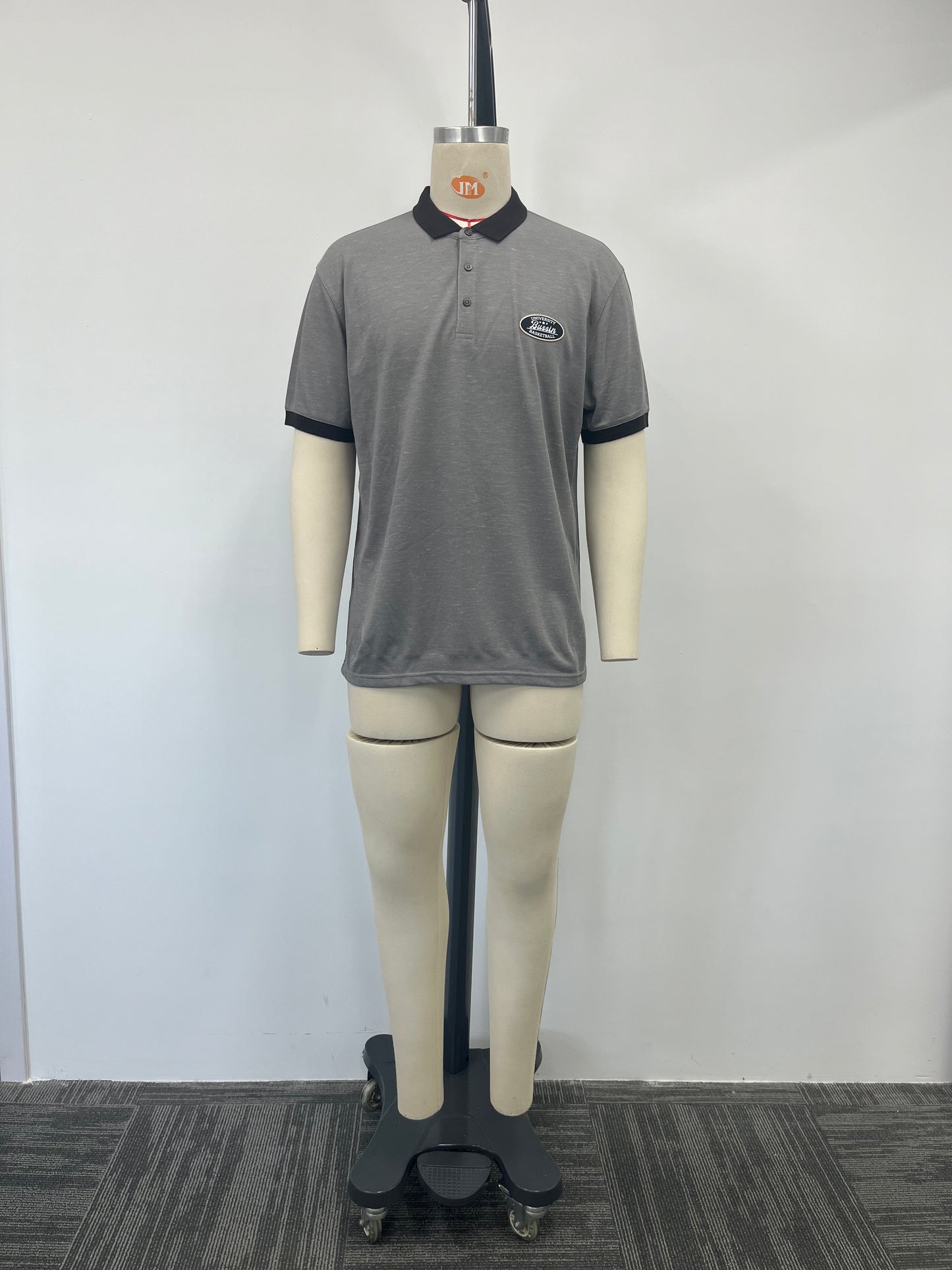 Polo shirt features a striking contrast of gray and black