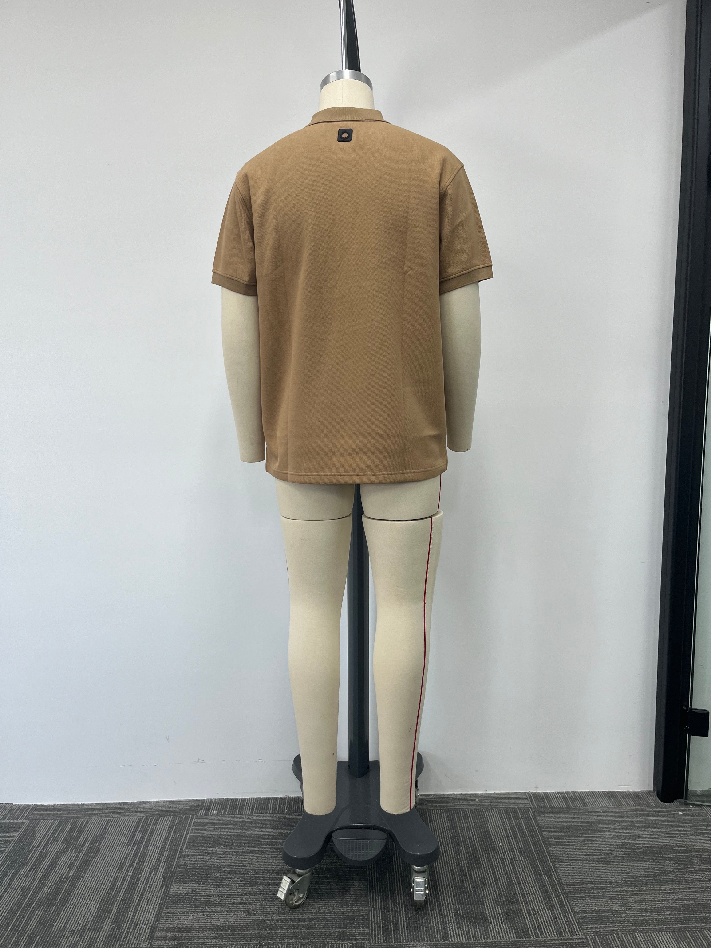 Polo shirt features a classic brown color and a genuine leather label