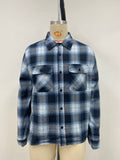 Men's grid-patterned shirt in black and white with blue accents