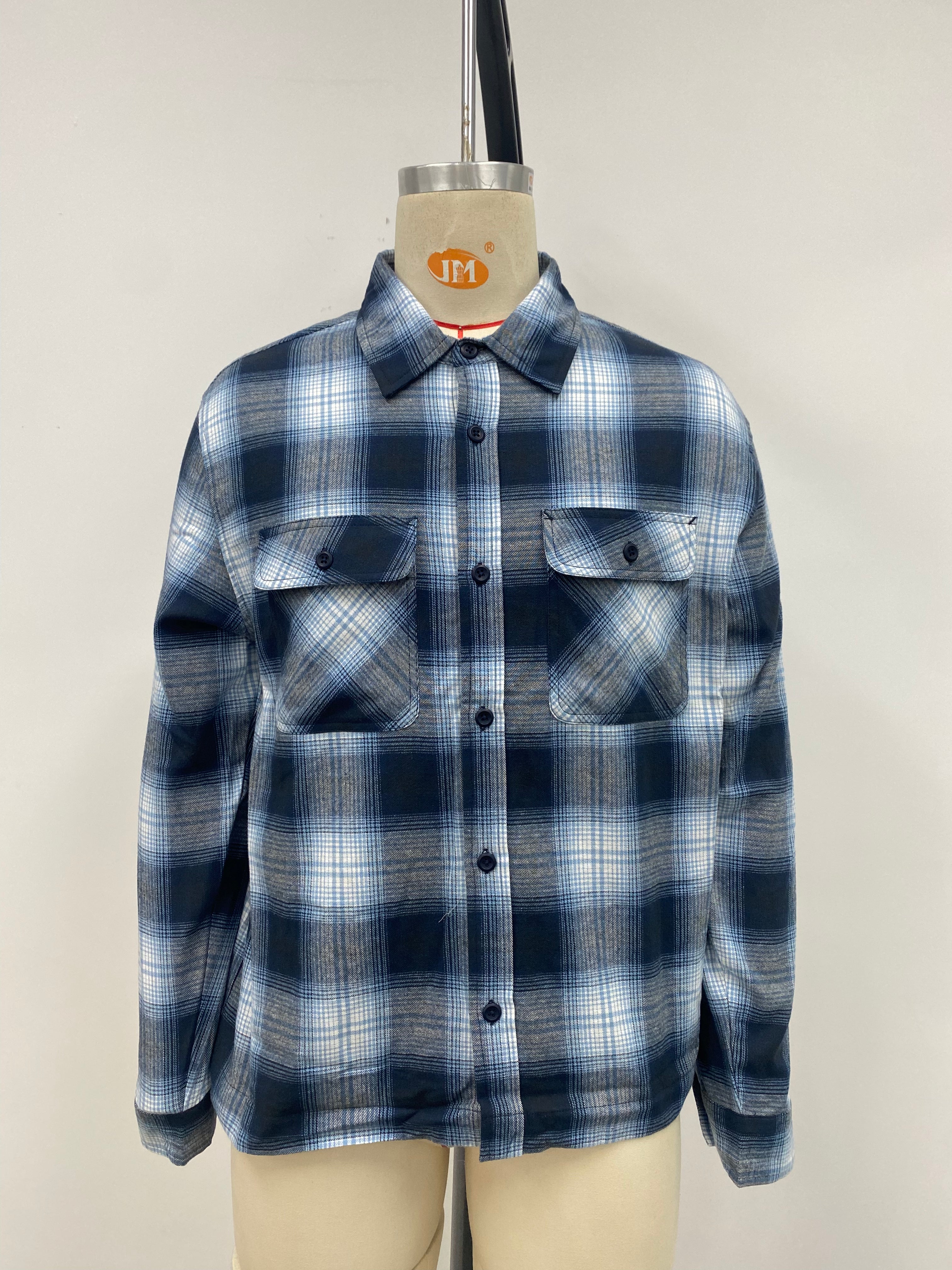 Men's grid-patterned shirt in black and white with blue accents