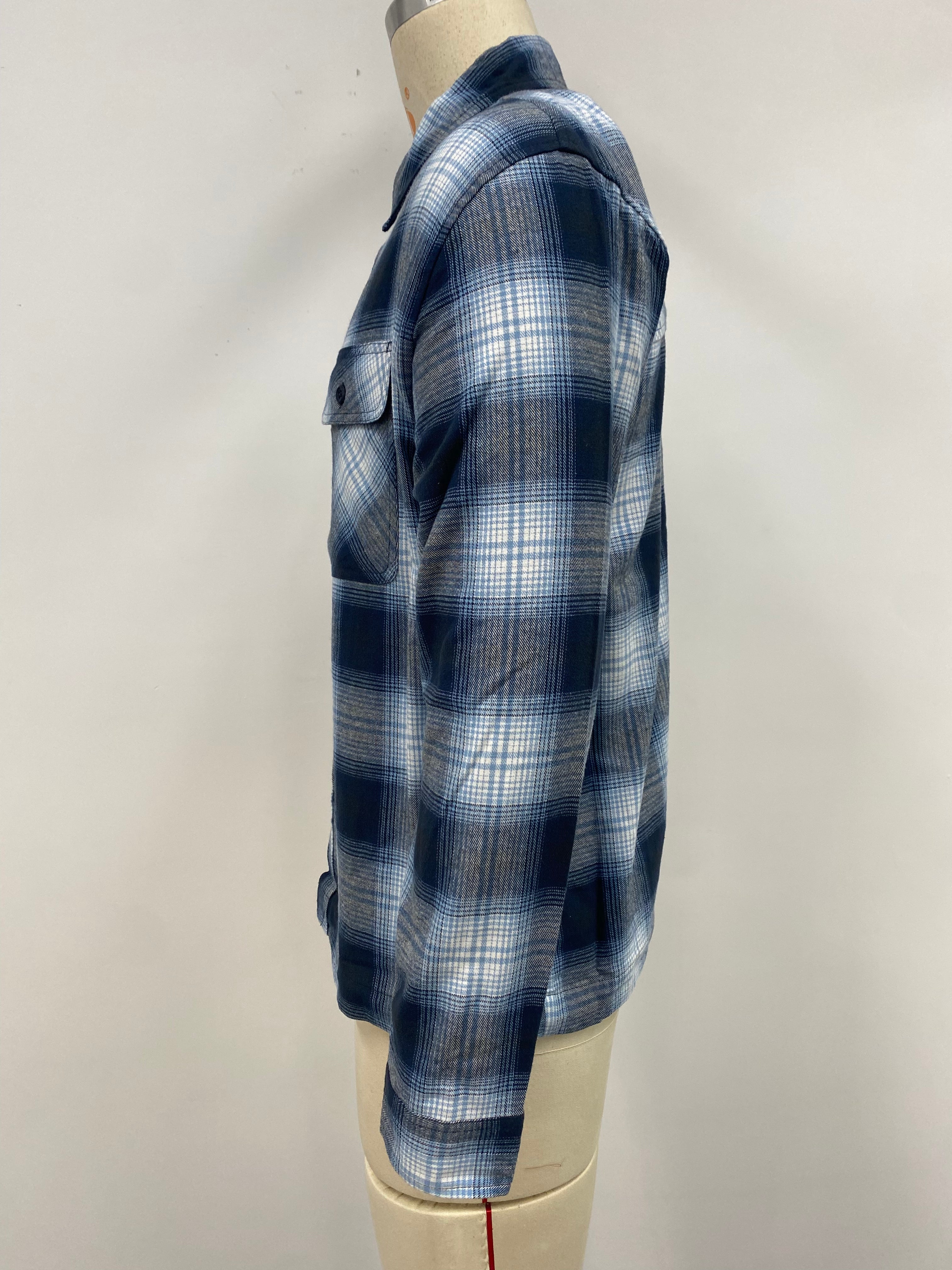 Men's grid-patterned shirt in black and white with blue accents