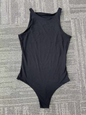 Black sleeveless one-piece swimsuit