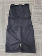 Black, form-fitting tummy control pants