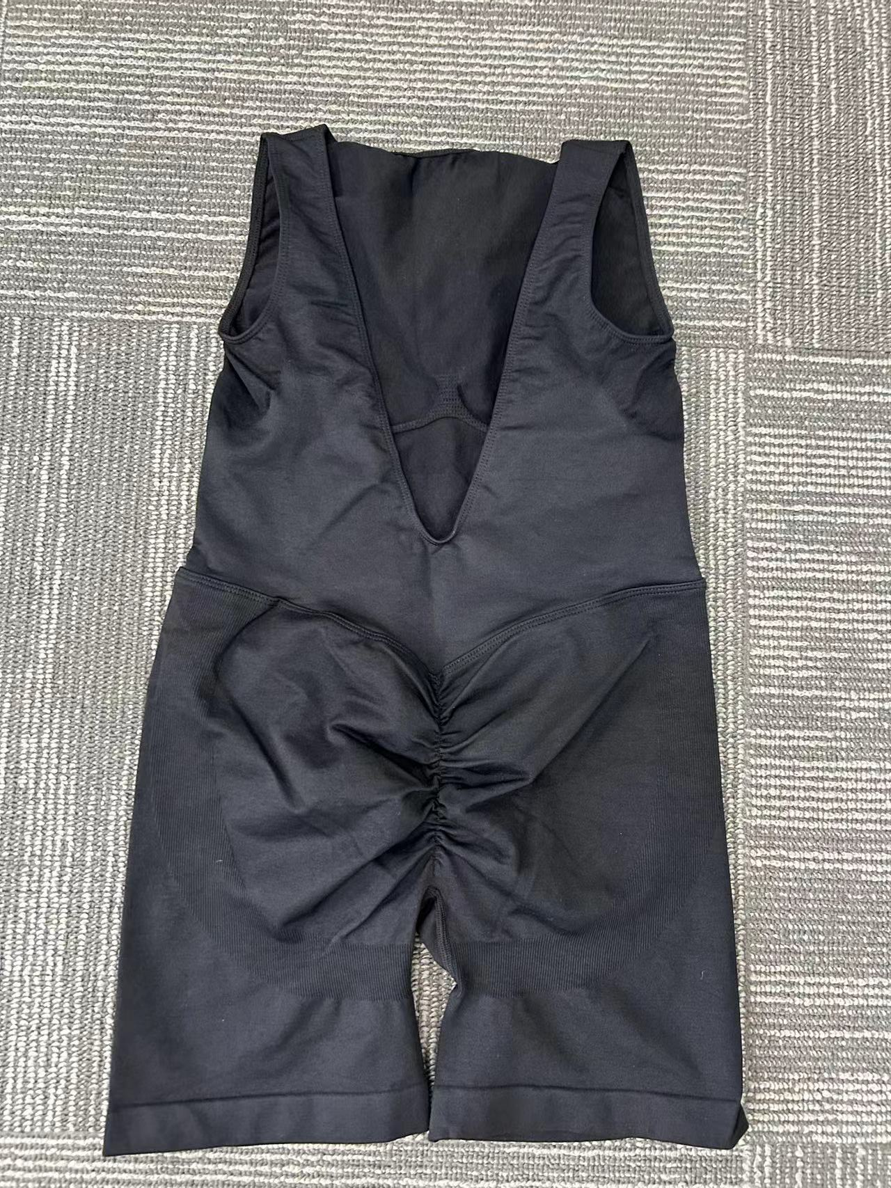 Black, form-fitting tummy control pants