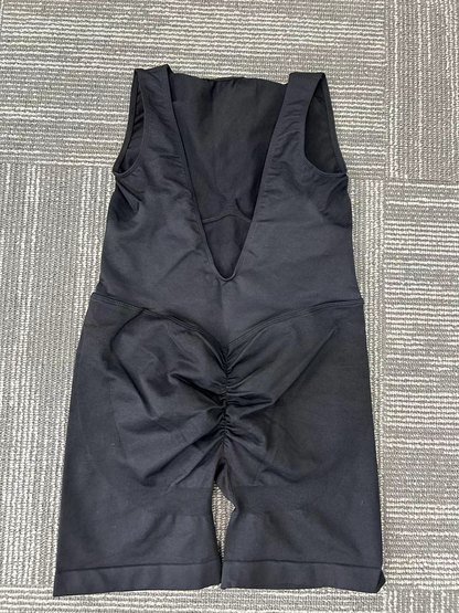 Black, form-fitting tummy control pants