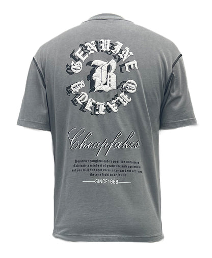 T-shirt features bold letter prints and a playful cream puff design