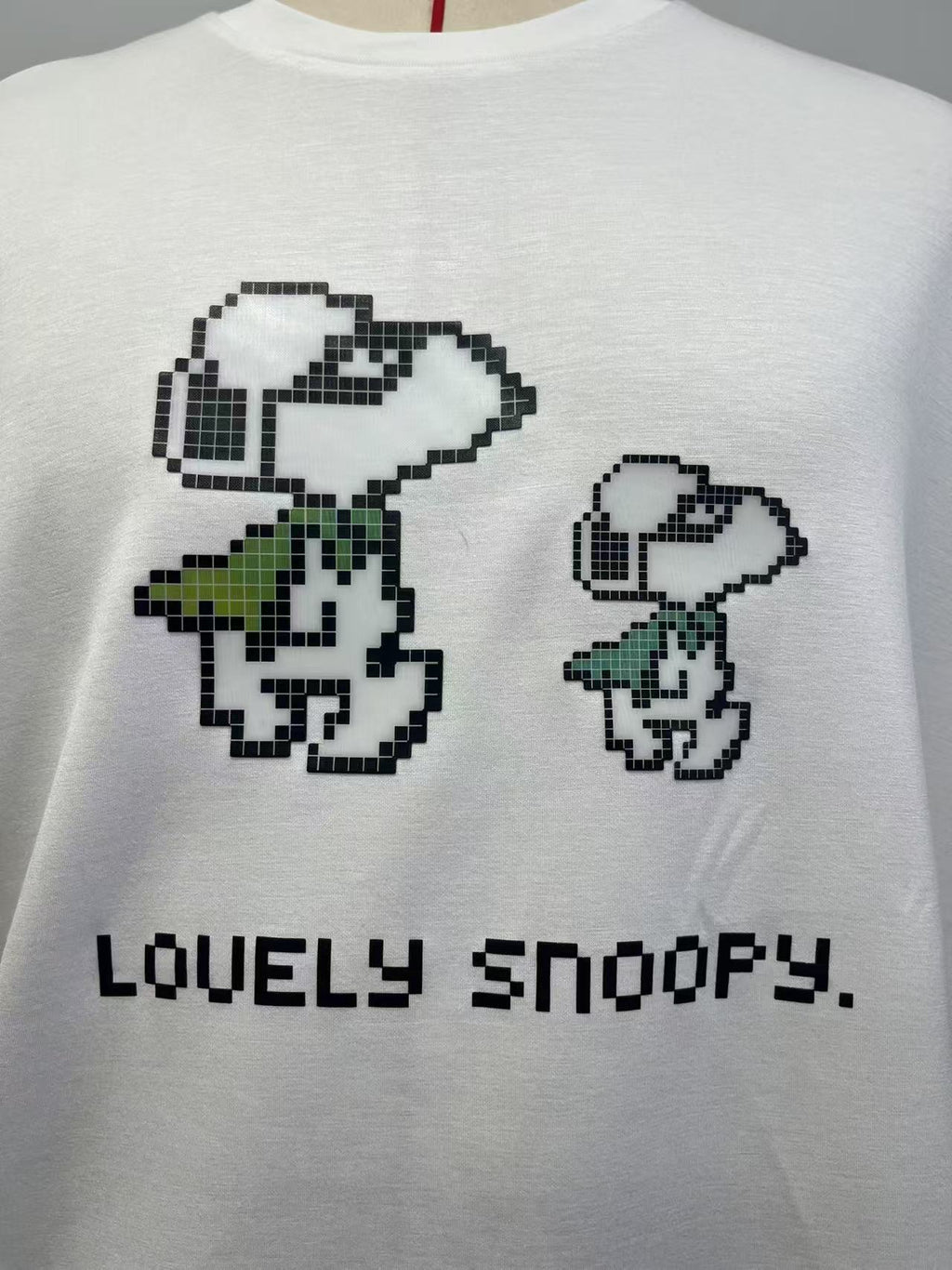 White T-shirt with a Lego-style cartoon pattern print