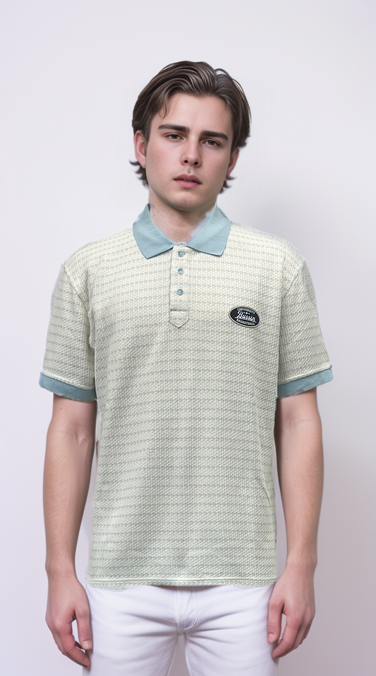 Polo shirt features a raised floral design and color-blocking details