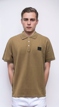 Polo shirt features a classic brown color and a genuine leather label
