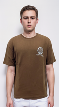 Brown t-shirt features a silver print