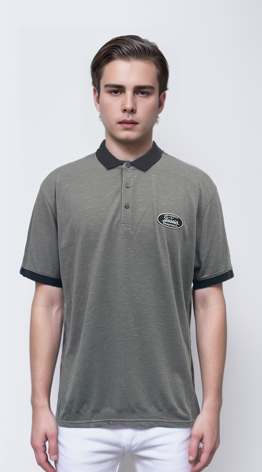 Polo shirt features a striking contrast of gray and black