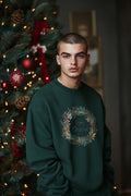 Men's sweatshirt features a Christmas wreath print