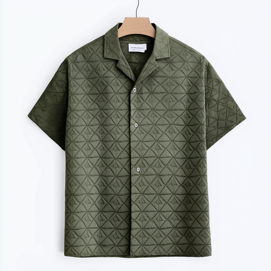 Green short-sleeved shirt features a raised patterned design