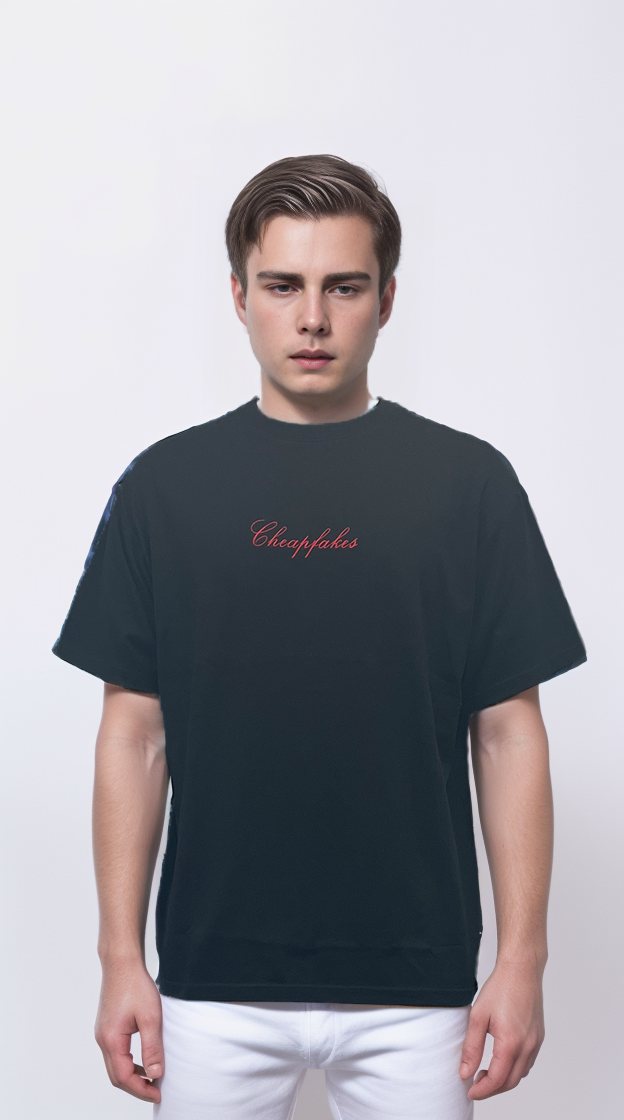 Black T-shirt features a large embroidered patch on the back