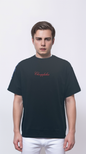Black T-shirt features a large embroidered patch on the back